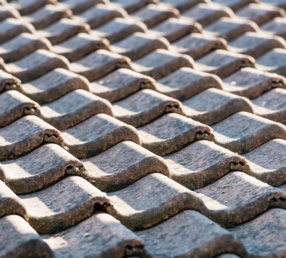 https://xbuiltroofing.com/wp-content/uploads/2024/02/concrete-roof-tiles-1.jpg